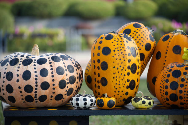 Colorful polka dot painted pumpkins outdoor display