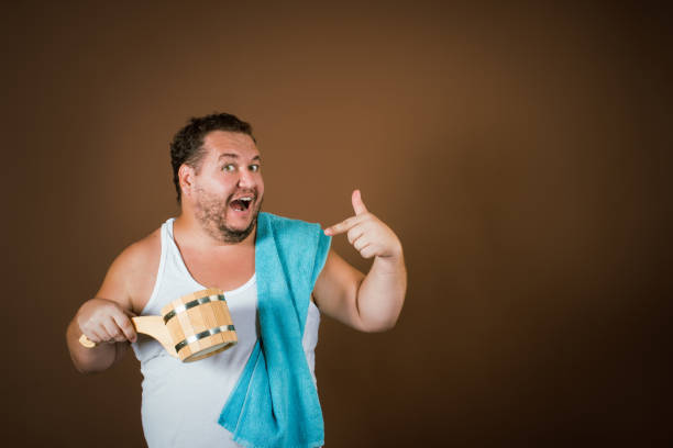 istock Funny fat guy in the sauna. 2177352569
