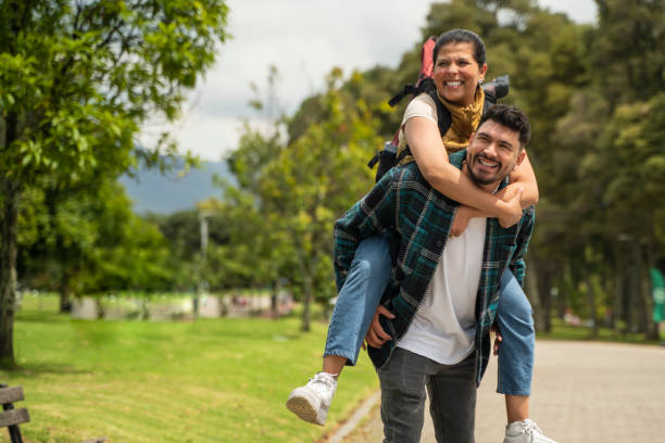 istock couple in love walking in the park 2177352953