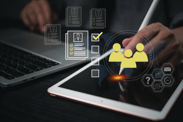 istock Digital recruitment process on a tablet, selecting a candidate profile for hiring. Great for HR technology, employment solutions, and team management. 2177353072