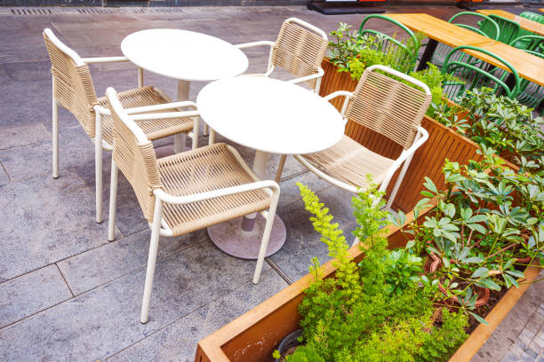 Outdoor street cafe with empty tables and chairs