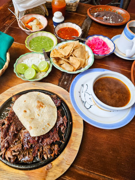 istock Plate of birria with consome and its accompaniments in a Mexican restaurant 2177354890