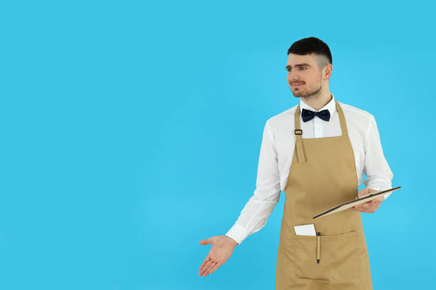 istock Concept of occupation, young waiter on blue background 2177359283