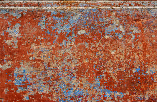 Old grunge wall with blue and red paint. Abstract background for design.