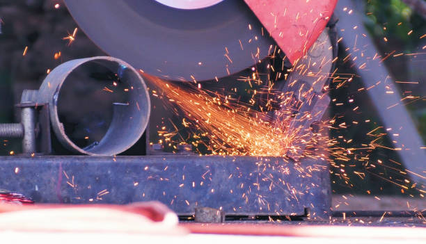 istock Hot flame welding metal work cutting fire iron workshop. Welding machine iron metal sparking. Locksmith using Welding machine cutting metal processing grinder. Close up hands Sparks in metalworking 2177362205