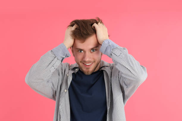 istock Concept of people with young man on pink background 2177362350