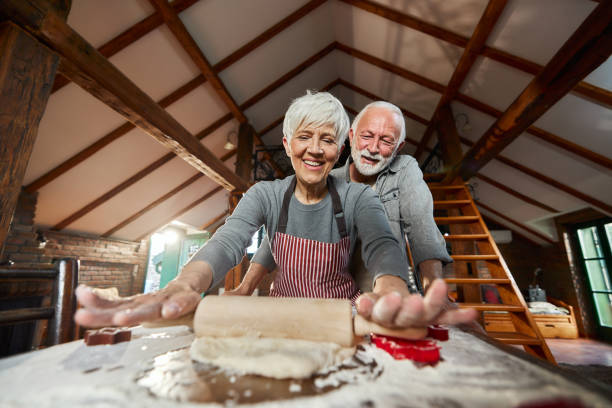 istock Happy senior couple kneading pastry dough in the kitchen. 2177362532