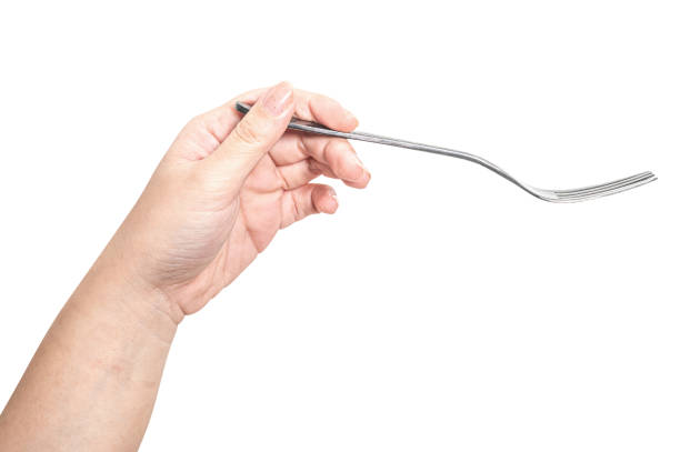 istock Female hand holding a silver steel fork isolated on white background. 2177362803