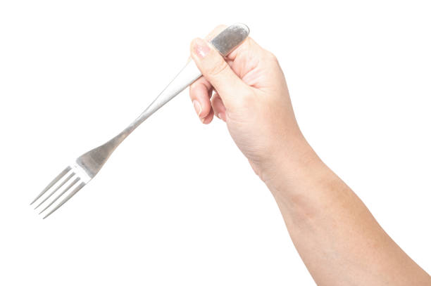istock Female hand holding a silver steel fork isolated on white background. 2177362811