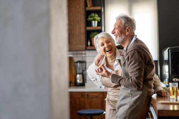 istock Happy senior couple communicating while having fun in the kitchen together 2177364495