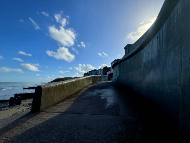 The promenade and old houses on the sea front at Cromer in Norfolk. October 2024