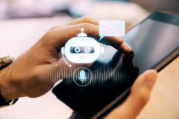 istock Person interacting with chatbot on smartphone screen, holographic bot icon on display. 2177368321