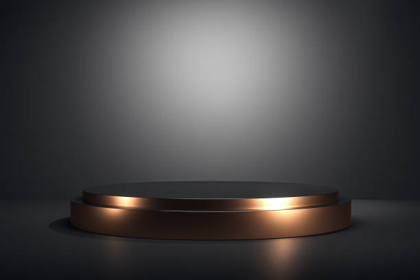 istock Modern pedestal display with golden accents on a clean background. 3D Rendering 2177369366