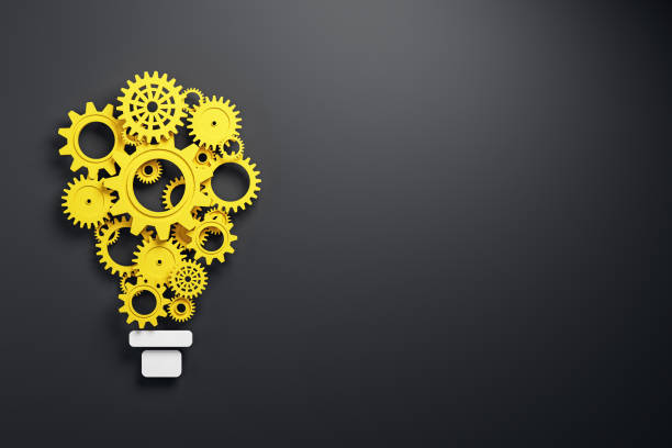 istock Yellow cogwheels forming a lightbulb on a black background. 3D Rendering 2177369389