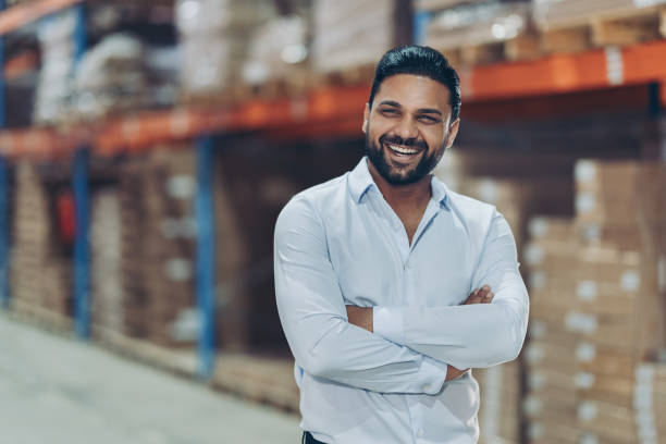 istock Smiling young businessman standing with crossed arms 2177371312