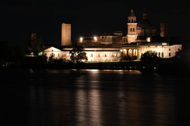 Historic city. View with the lake of the river Mincio and the monuments of the city illuminated. Italy Mantua, Lombardy, Italy