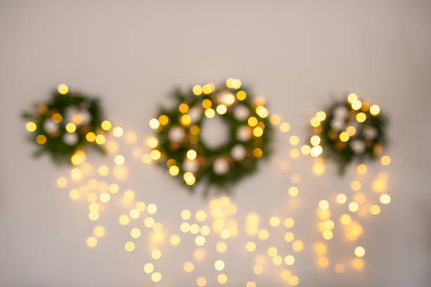 Christmas home room with tree and festive bokeh lighting, blurred holiday background.