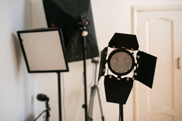istock Photography studio flash on a lighting stand on white background with lamp. Proffetional equipment like monobloc or monolight 2177375810