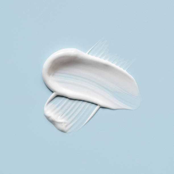 istock Smear of cream on a blue background. 2177379007