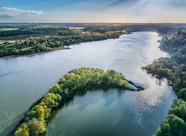 istock Small Danish lake Rorbaek with green sourroundings in Denmark 2177379797