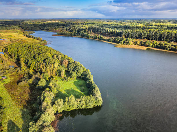 istock Small Danish lake Rorbaek with green sourroundings in Denmark 2177379801