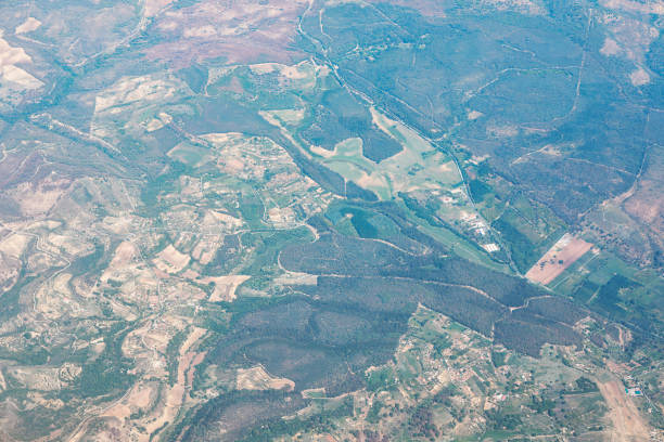 Flight above a vast landscape with expansive terrain below. Flying above Sicily island