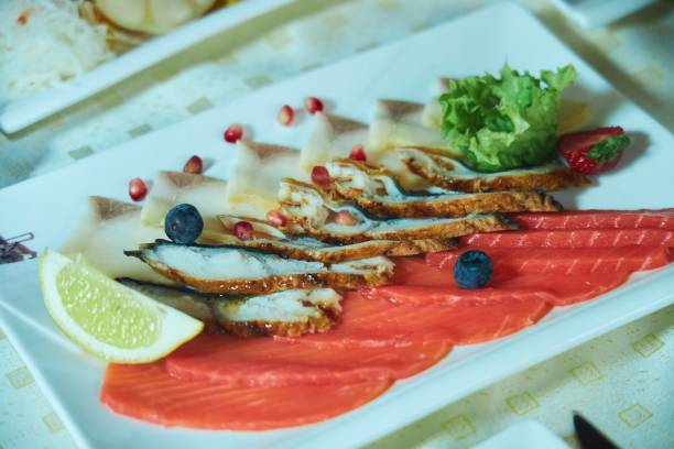 istock A plate with fish slices. Red fish, salmon or trout, eel. 2177381453