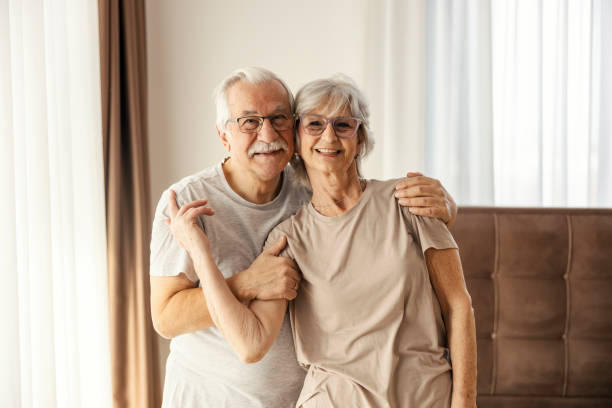 istock An affectionate senior couple standing in a bedroom at nursing home and hugging. 2177381484