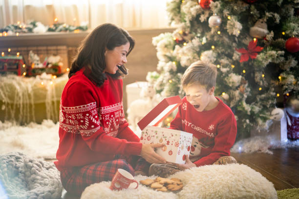 istock Woman giving Christmas present to her son 2177382657