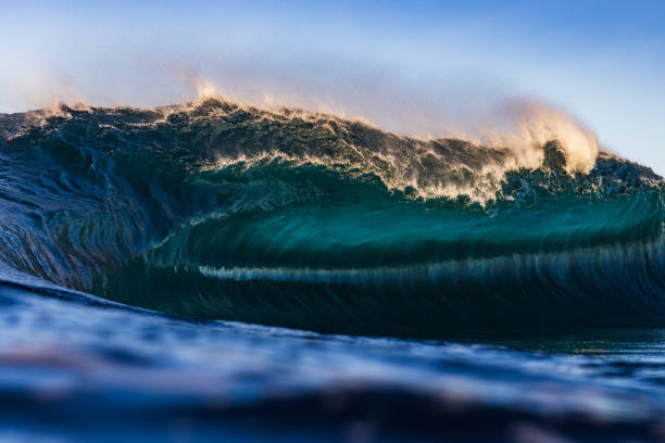 istock Close up of blue wave breaking in the ocean with soft afternoon light 2177383804