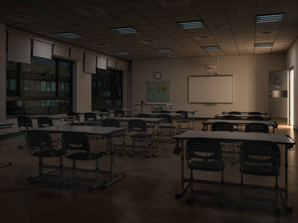 Empty Modern Classroom Interior With Rear View Of Chairs And Desks At Night