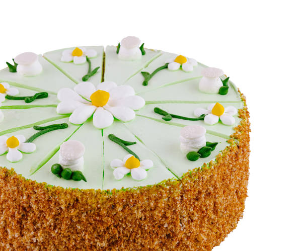 istock Delicious biscuit cake decorated with green butter cream and daisies 2177385205