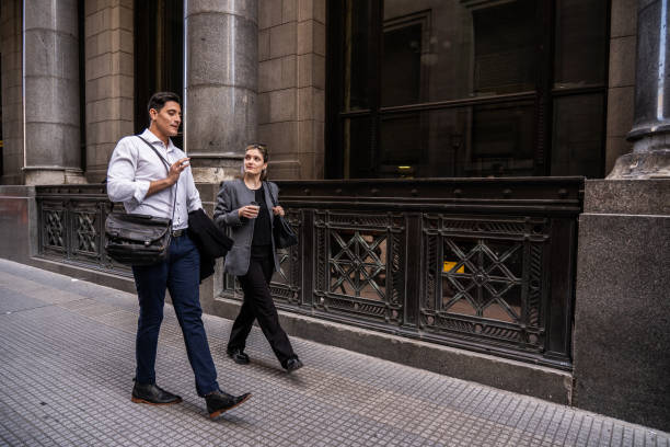 istock Coworkers talking and walking in the city 2177386432