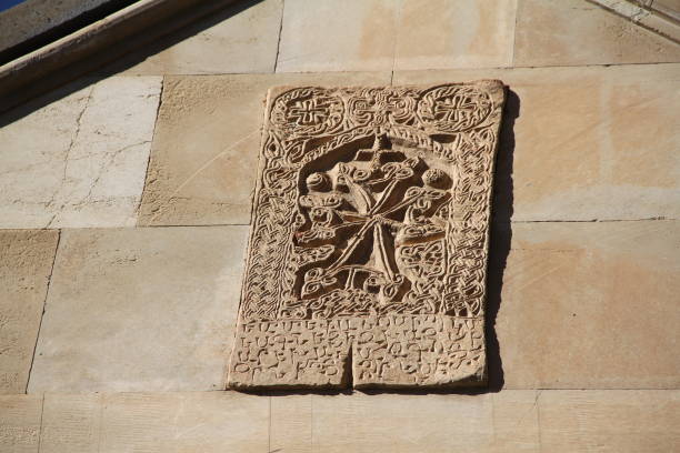 istock Ancient stone relief with intricate carvings and inscriptions on a wall. 2177387405