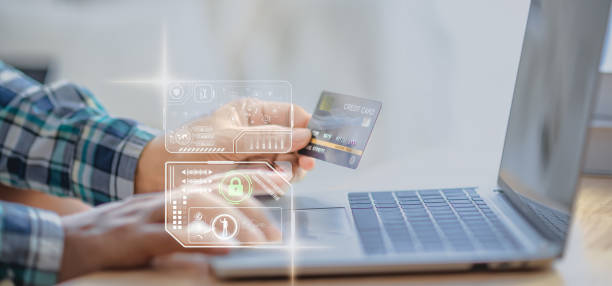 istock Customers using mobile devices and laptops to make credit card payments security, Cyber security and futuristic technology concept, mobile banking for safe financial transactions AI system 2177387462