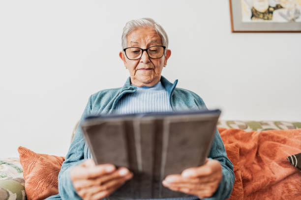 istock Senior woman using digital tablet at home 2177388055