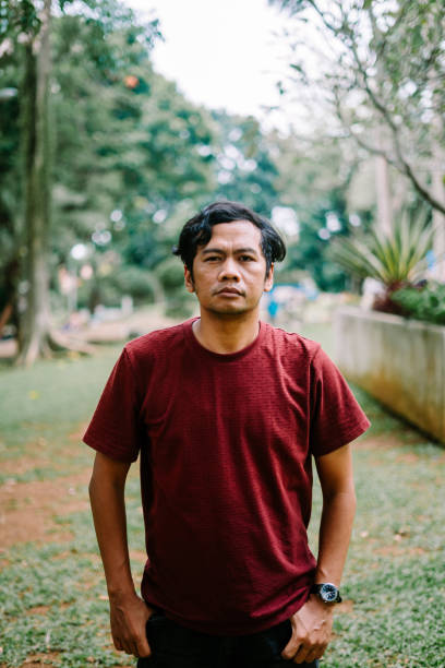 istock Southeast Asian man with a flat, expressionless face, conveying neutrality or indifference 2177388500