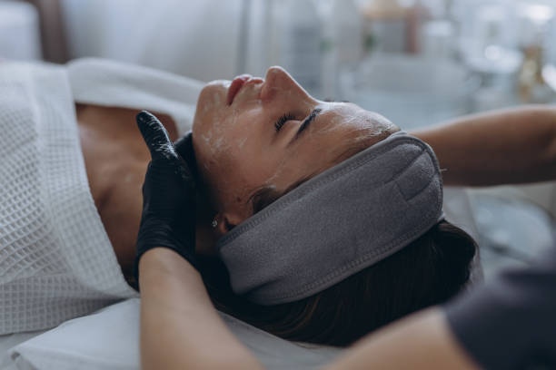 istock Cosmetologist performs a facial peeling procedure on a young woman. 2177389357