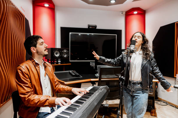 istock Musicians singing and playing at music studio 2177391466