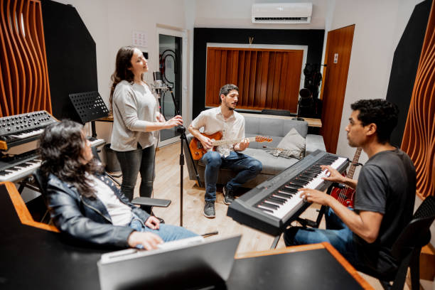 istock Friends singing and playing at music studio 2177391532