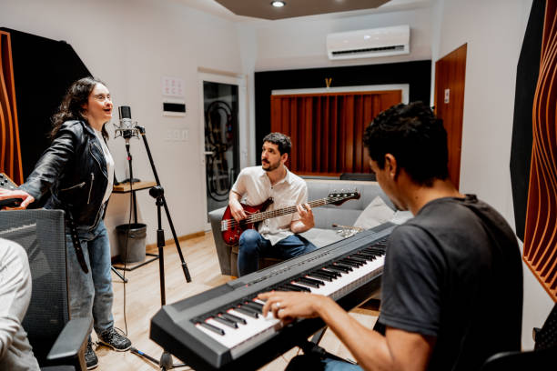 istock Musicians singing and playing at music studio 2177391553