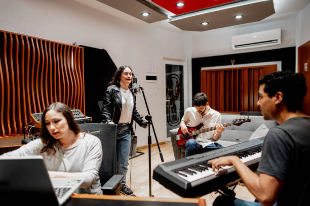 istock Musicians singing and playing at music studio 2177391558