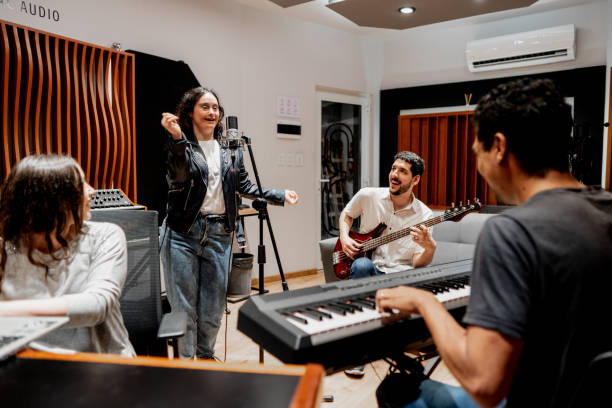 istock Friends singing and playing at music studio 2177391564