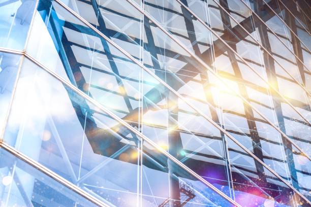 istock Reflective glass facade of a modern skyscraper with sunlight and blurred bokeh. 2177391823