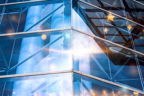 istock Modern architecture with glass windows reflecting light and the sky. 2177391891