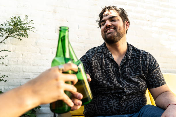 istock Young man toasting with friends at backyard 2177392276