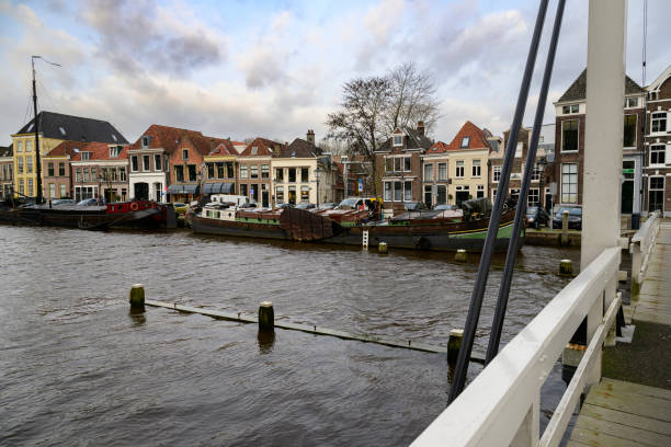 Torbeckegracht panoramic view with high water level in the canal in the city center of Zwolle during a dark winter day in Zwolle, Netherlands at the Pelserbrug.
