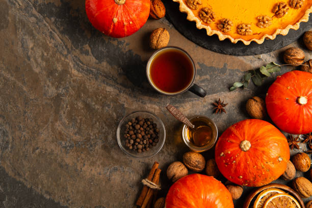 istock A festive Thanksgiving table with pumpkins, spices, and a delicious waiting pie 2177392999