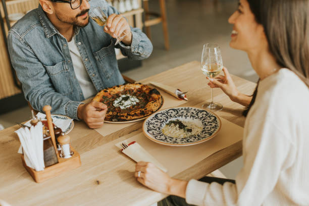 istock A cozy dinner date between two people enjoying drinks in a stylish restaurant atmosphere 2177393018