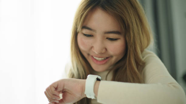 istock Woman talking with voice assistant on smartwatch. 2177393585